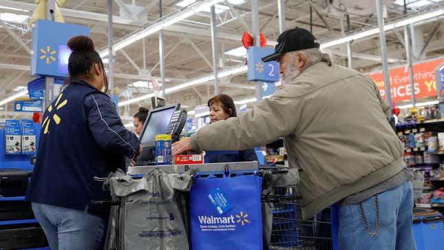 A customer bags his groceries after shopping at a Walmart store ahead of the Thanksgiving holiday in Chicago, Illinois, U.S. November 27, 2019.