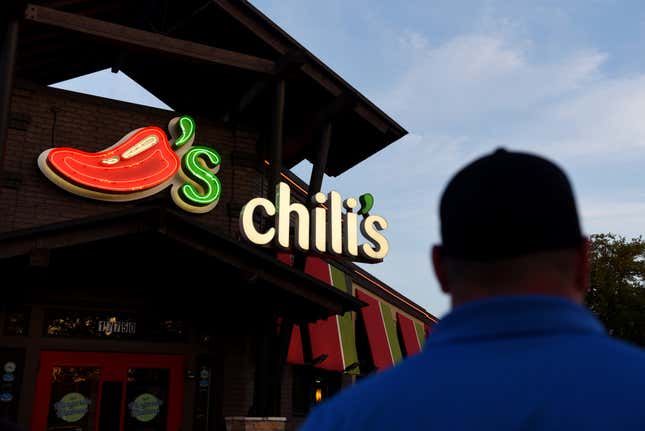 A customer walks towards the entrance of a Chili’s Grill & Bar restaurant in San Antonio, Texas, U.S.