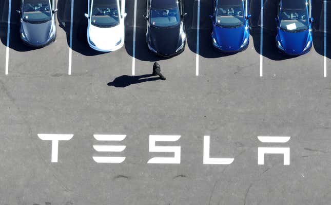 Brand new Tesla cars sit in a parking lot at the Tesla factory on October 19, 2022 in Fremont, California.