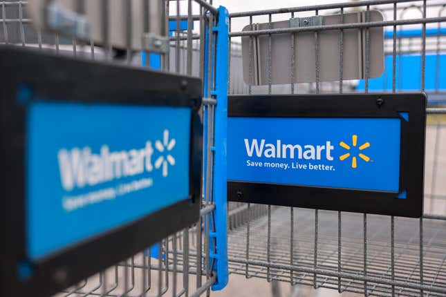close up of the front of two shopping carts with the walmart logo