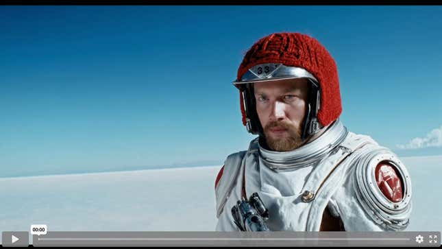 A movie trailer featuring the adventures of the 30 year old space man wearing a red wool knitted motorcycle helmet, blue sky, salt desert, cinematic style, shot on 35mm film, vivid colors.