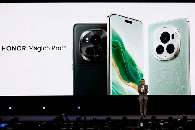 CEO of Honor Device George Zhao stands in front of a backdrop showing the Honor Magic6 Pro