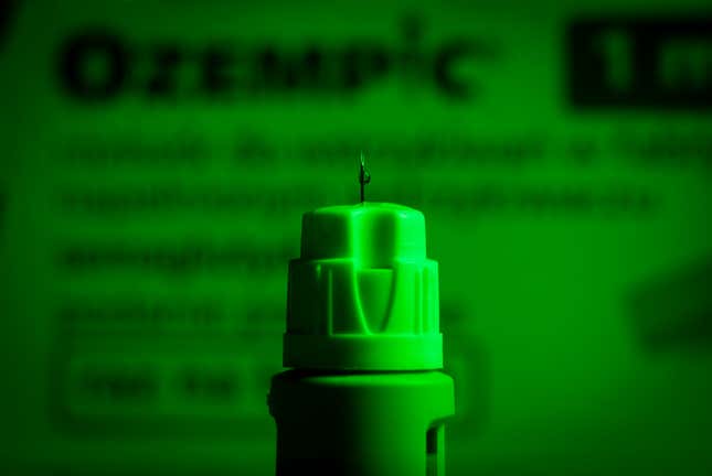 An Ozempic needle injection pen is seen in this illustration photo in green lighting