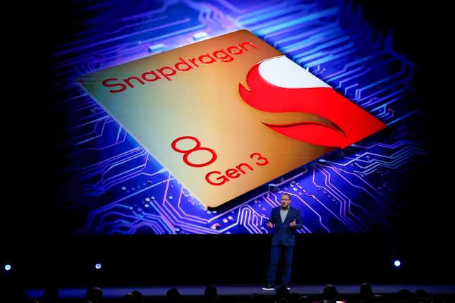 President and CEO of Qualcomm Incorporated speaks on stage in front of Snapdragon 8 Gen 3 backdrop