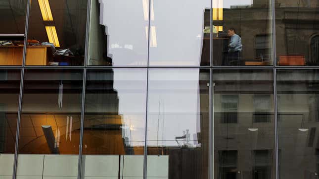 A worker sits at his desk in an office building in Washington, U.S., August 3, 2018.